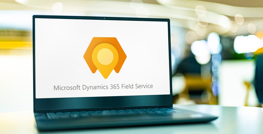 Microsoft Dynamics 365 Field Service logo on laptop screen