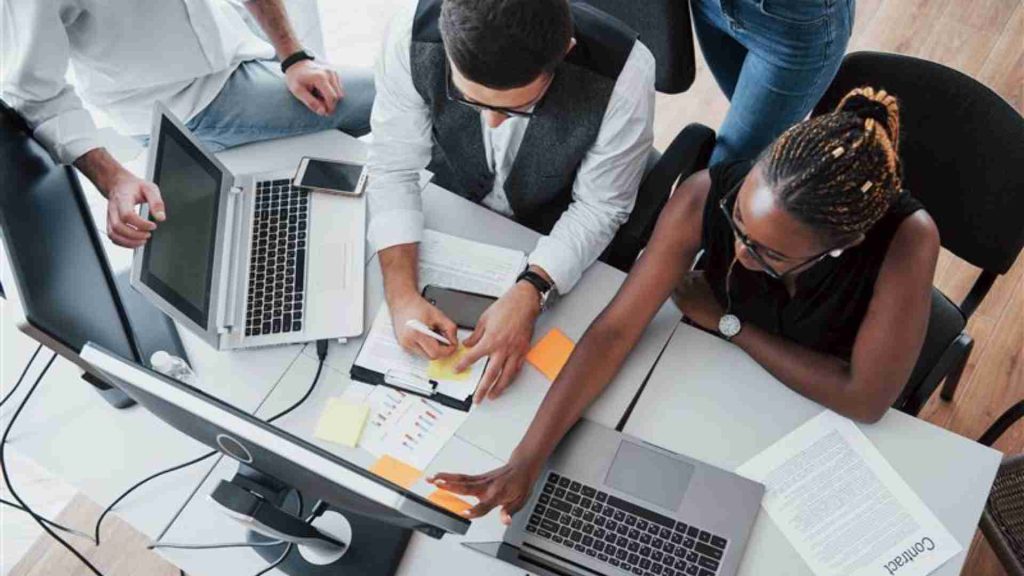 Made with insMind group multinational busy people working office 1